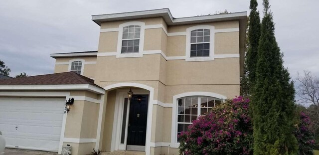 view of front of home with a garage