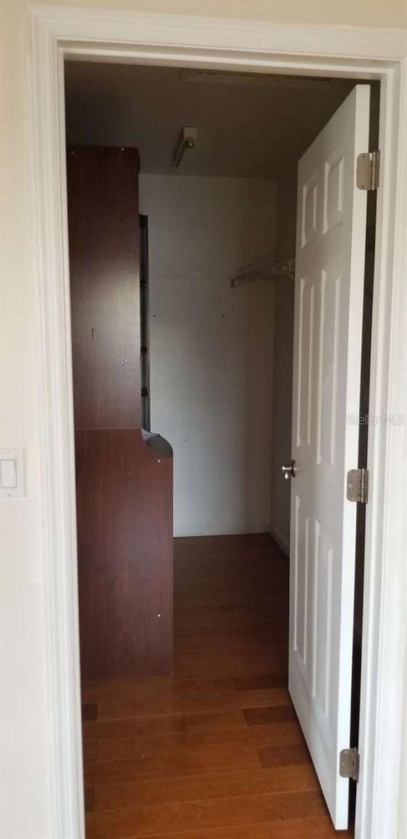 hallway featuring hardwood / wood-style flooring