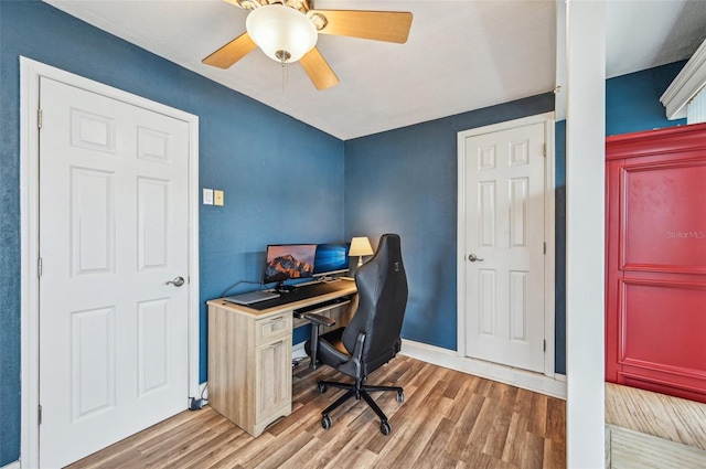 office space with hardwood / wood-style flooring and ceiling fan