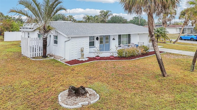 single story home featuring a porch and a front yard