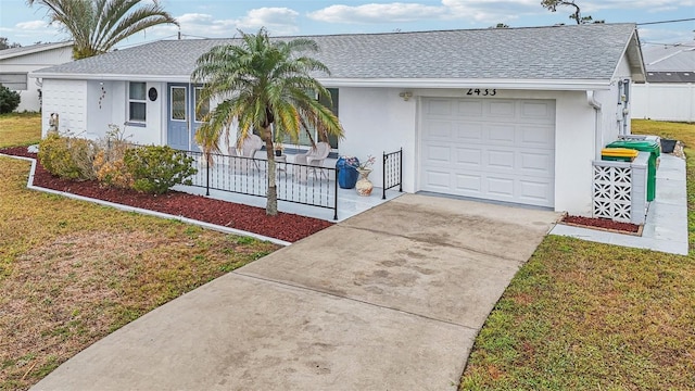 single story home featuring a garage, covered porch, and a front yard