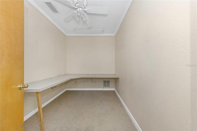 unfurnished office featuring baseboards, ceiling fan, visible vents, and crown molding