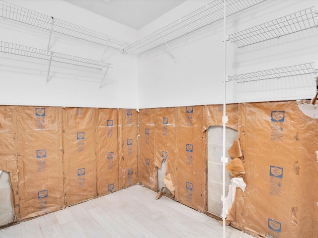 laundry room with light hardwood / wood-style floors