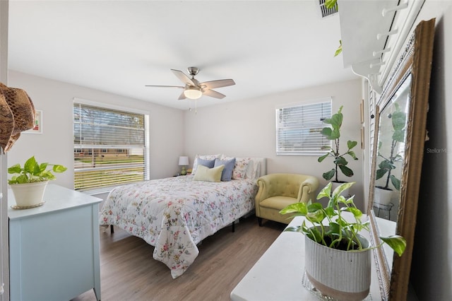 bedroom with hardwood / wood-style floors and ceiling fan