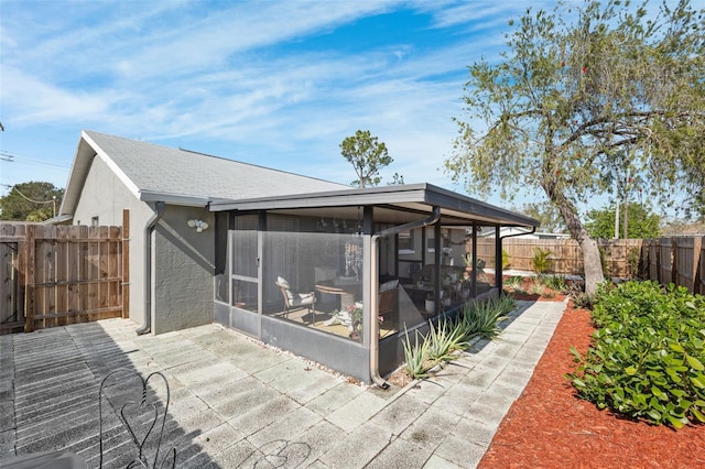 exterior space featuring a sunroom