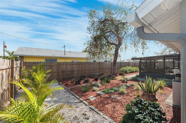 view of yard featuring a sunroom