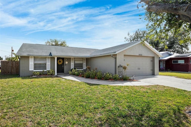 ranch-style home featuring a garage and a front lawn