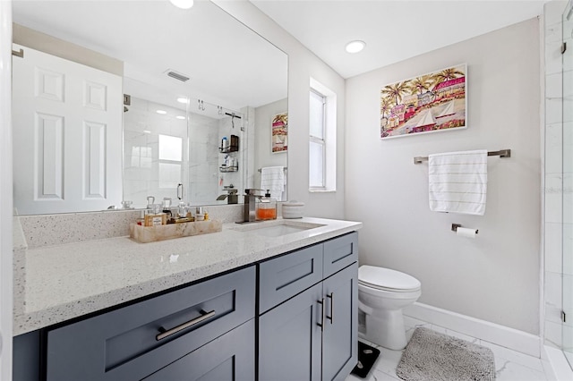 bathroom featuring walk in shower, vanity, and toilet