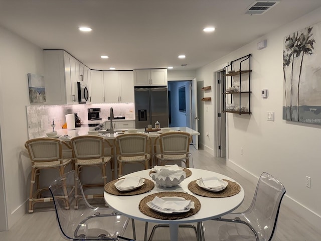 dining area featuring sink