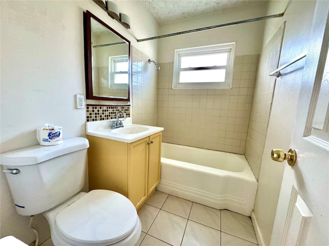 full bathroom featuring toilet, tiled shower / bath, vanity, tile patterned flooring, and decorative backsplash