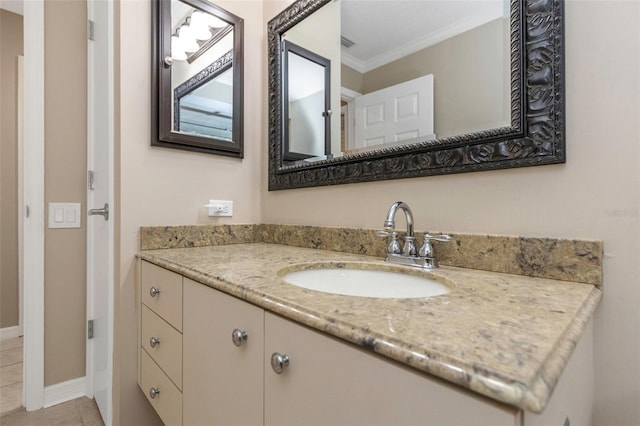 bathroom with vanity, tile patterned flooring, and ornamental molding