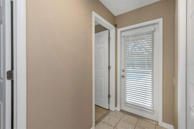 entryway featuring light tile patterned floors