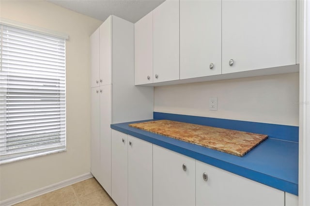 kitchen featuring white cabinets