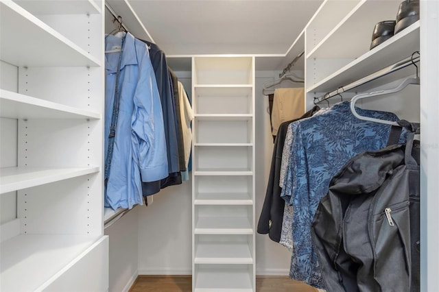 spacious closet featuring hardwood / wood-style floors