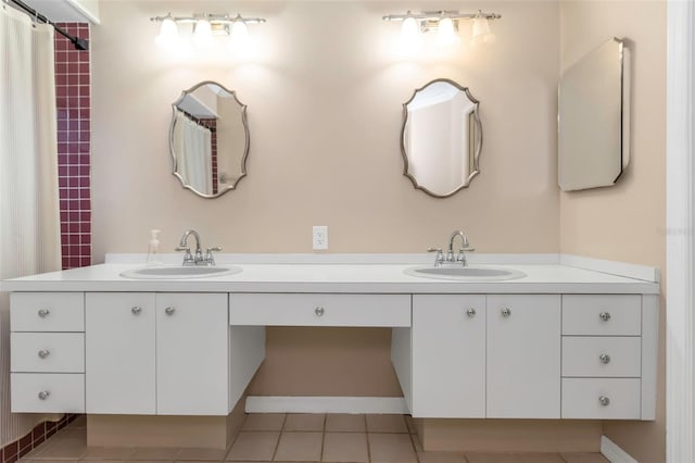 bathroom with vanity and tile patterned floors