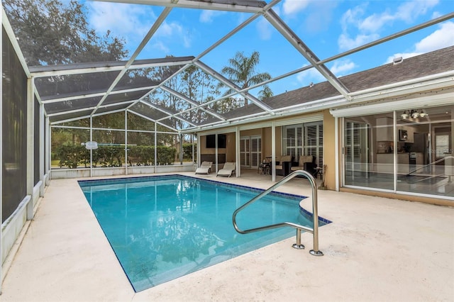 view of pool featuring a patio and glass enclosure