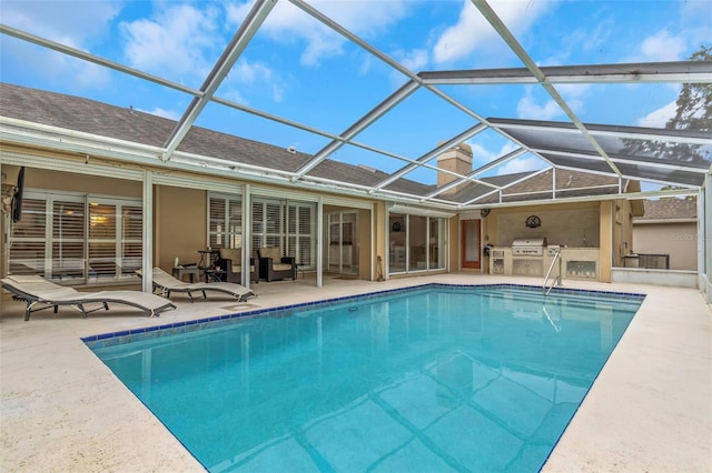 view of pool with a lanai and a patio