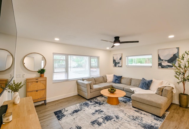 living area with recessed lighting, baseboards, wood finished floors, and a ceiling fan