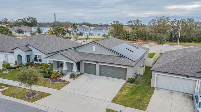 view of front facade featuring a front yard and a garage