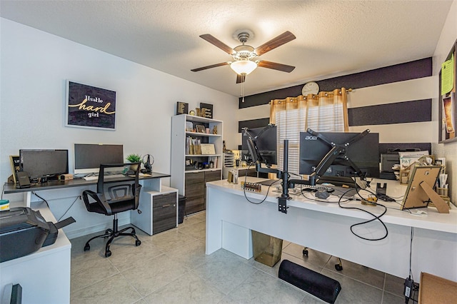 home office with a textured ceiling and ceiling fan