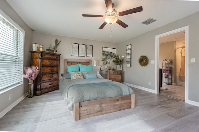 bedroom with ceiling fan and hardwood / wood-style floors