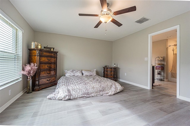 bedroom with ceiling fan and hardwood / wood-style floors