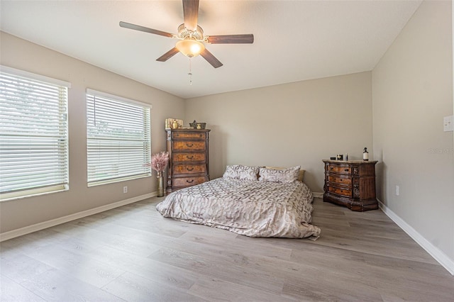 bedroom featuring ceiling fan and hardwood / wood-style floors