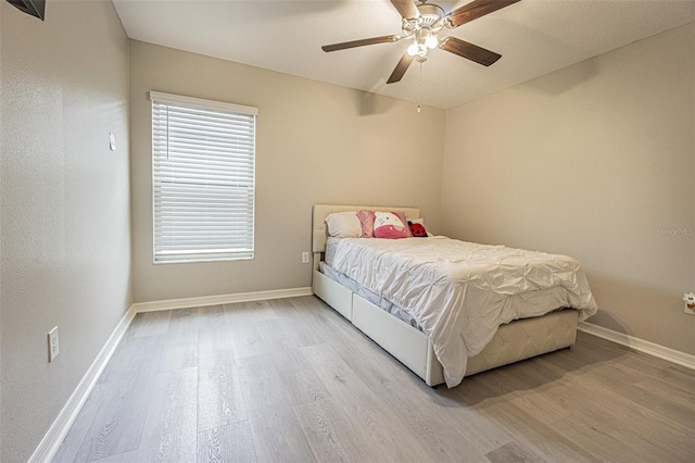 bedroom featuring ceiling fan and light hardwood / wood-style floors