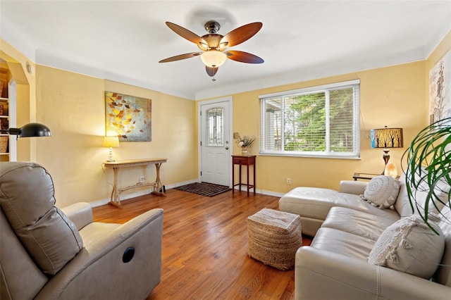 living room with ceiling fan and wood-type flooring