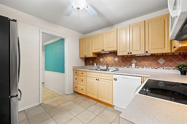 kitchen with light tile patterned floors, ceiling fan, decorative backsplash, white appliances, and sink