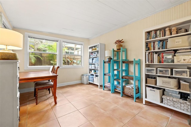 tiled home office featuring built in shelves and crown molding