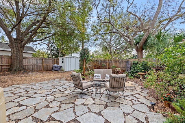 view of patio featuring a storage shed and an outdoor hangout area