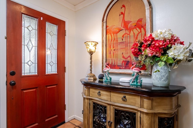 entryway featuring light tile patterned flooring, crown molding, and plenty of natural light