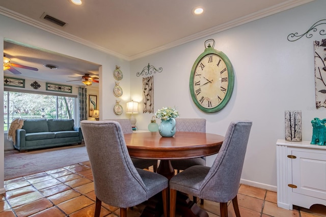 dining area featuring ceiling fan, light tile patterned floors, and crown molding