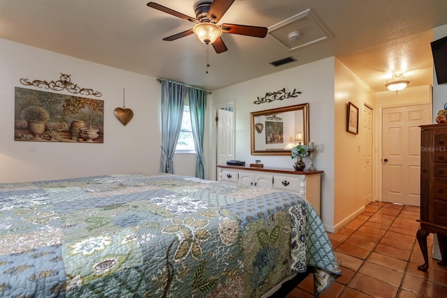 bedroom with ceiling fan and light tile patterned flooring