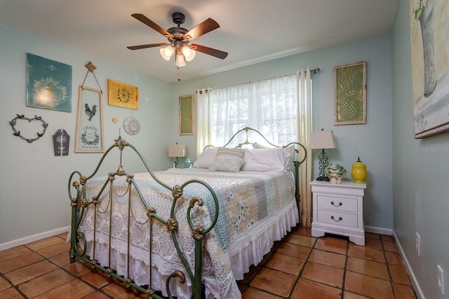 bedroom featuring ceiling fan and dark tile patterned floors