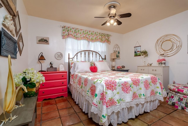 tiled bedroom with ceiling fan