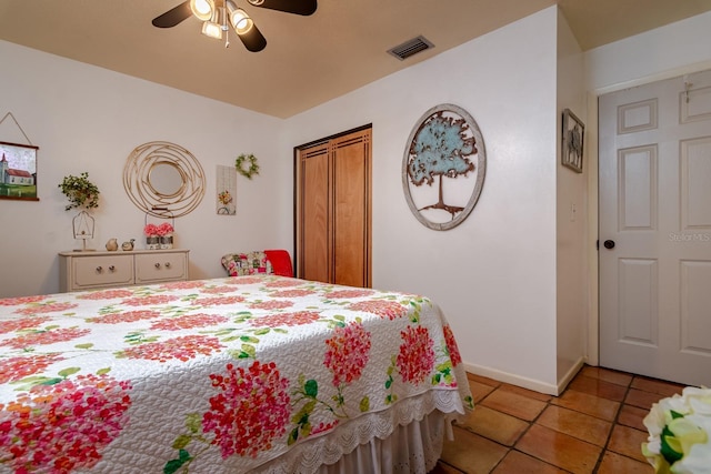 bedroom with ceiling fan and light tile patterned floors