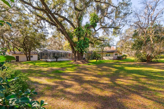 view of yard with a lanai