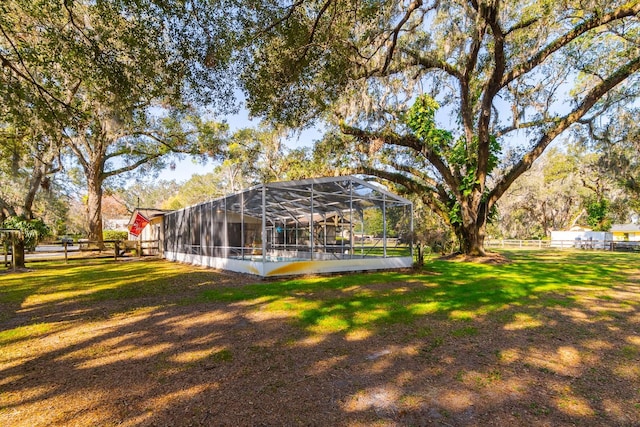 view of yard featuring glass enclosure