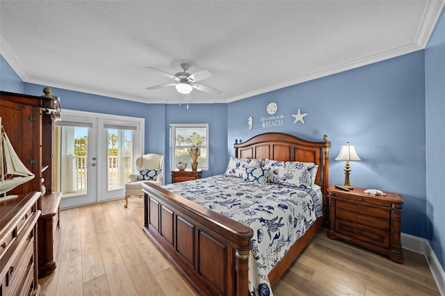 bedroom with crown molding, access to outside, light hardwood / wood-style floors, and french doors