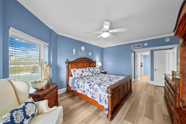 bedroom featuring ceiling fan, ornamental molding, and light wood-type flooring