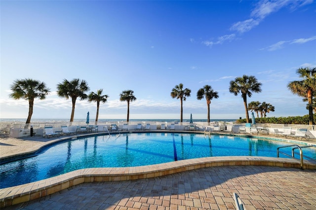 view of swimming pool featuring a patio area