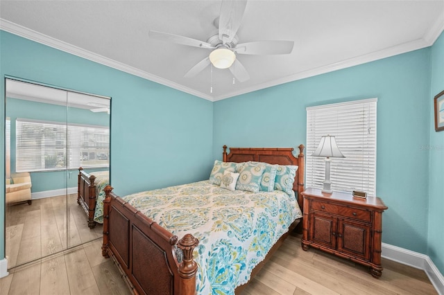 bedroom featuring light hardwood / wood-style flooring, ornamental molding, and ceiling fan