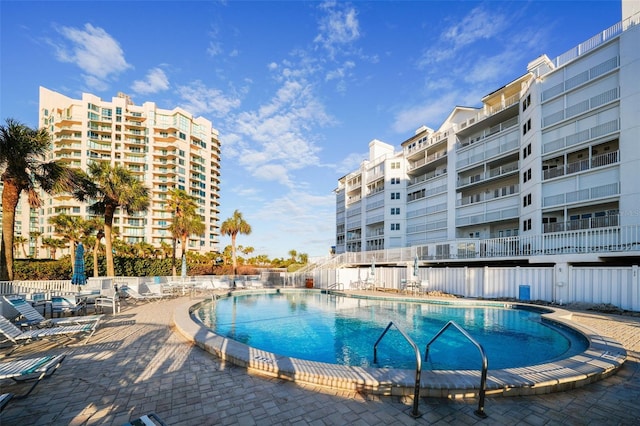 view of swimming pool with a patio area