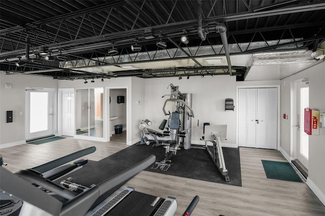 gym with wood-type flooring and plenty of natural light