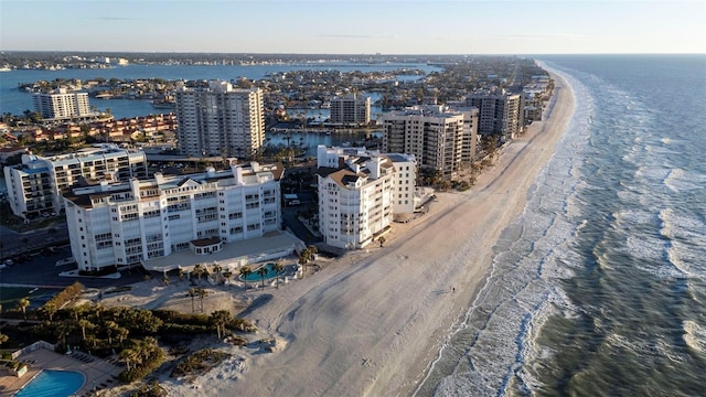 birds eye view of property featuring a water view and a view of the beach