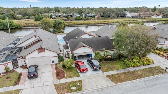 birds eye view of property featuring a water view