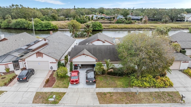 birds eye view of property featuring a water view