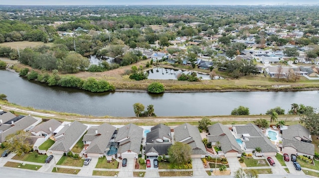 birds eye view of property featuring a water view